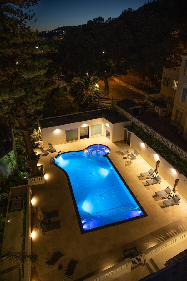 Outdoor pool, open 8:00 AM to 8:00 PM, pool umbrellas, pool loungers