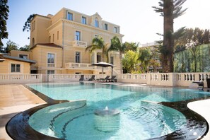Outdoor pool, open 8:00 AM to 8:00 PM, pool umbrellas, sun loungers