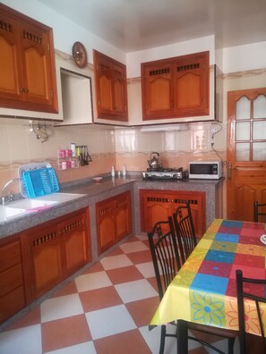 Fridge, coffee/tea maker, electric kettle, cookware/dishes/utensils