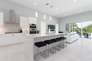 Fridge, microwave, oven, stovetop - Modern Luxury Villa | Splash Pad, Car Pool Table, Movie Room, Custom Kid Bedroom (Kissimmee)