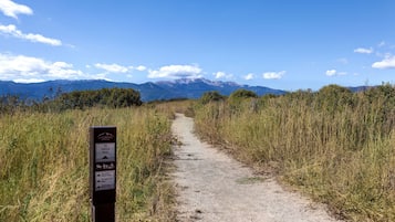 A dirt trail with a sign indicating the Colorado Yuca Trail.