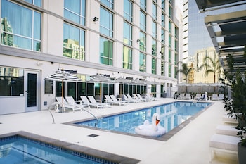 Outdoor pool amenities at Carte Hotel San Diego Downtown, Curio Collection by Hilton