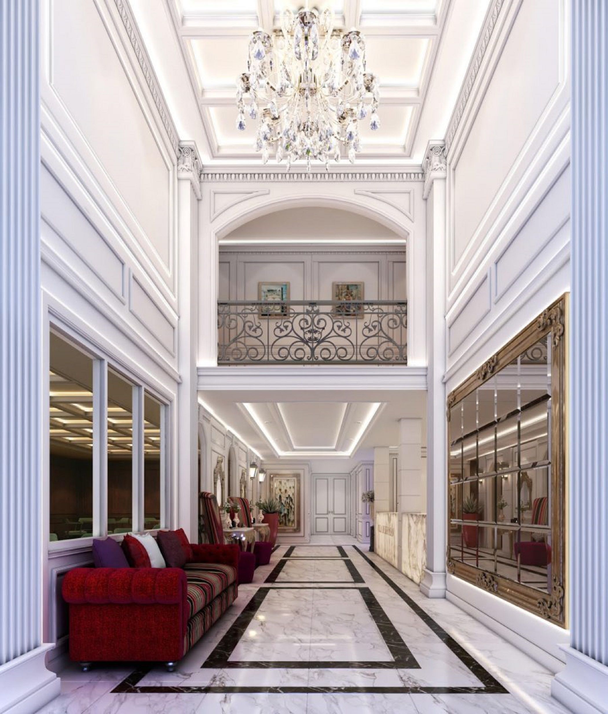 A grand hallway with a chandelier, red sofas, and a marble floor.