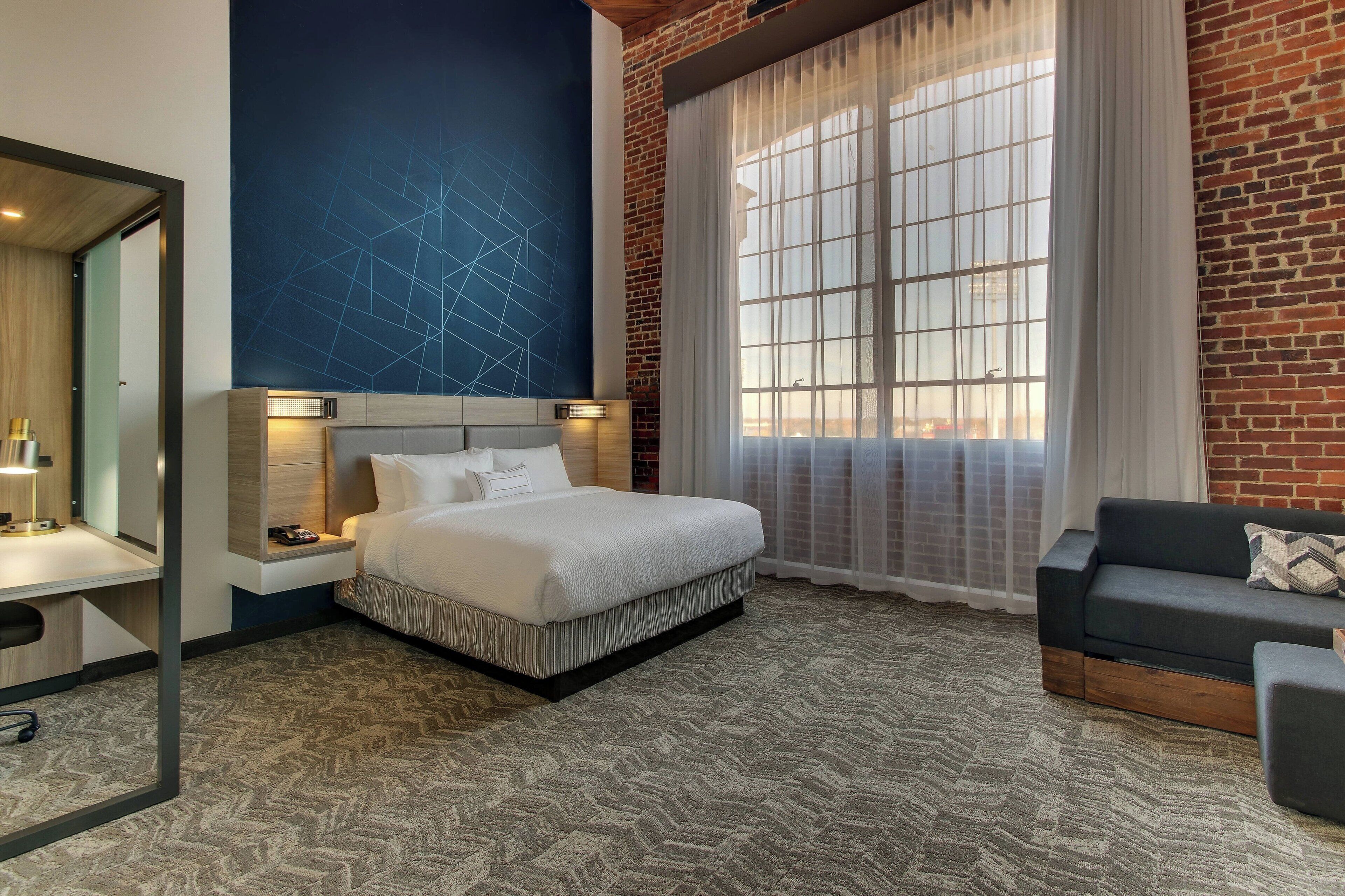 suite, 1 king bed, non smoking, river view | desk, iron/ironing board, cots/infant beds, free wifi