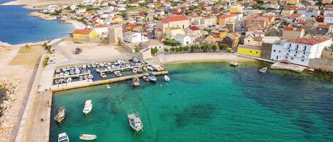 Experience the vibrant marina and historic charm of this coastal town, surrounded by picturesque views and traditional architecture.