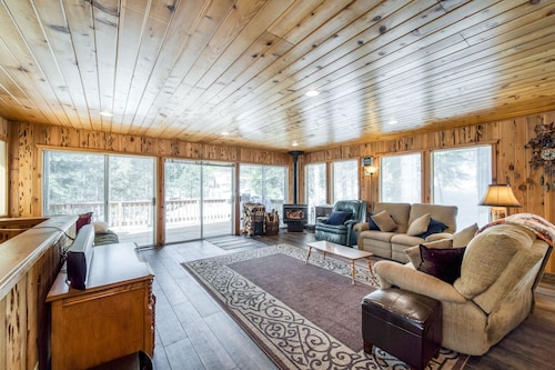 Rustic home with a wood stove, private dry sauna, & two decks with forest views