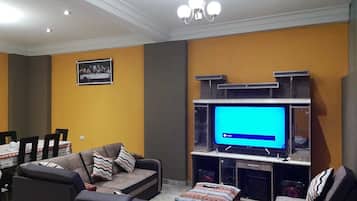 Apartment, Multiple Beds, Non Smoking | Living area | 60-inch Smart TV with cable channels, TV