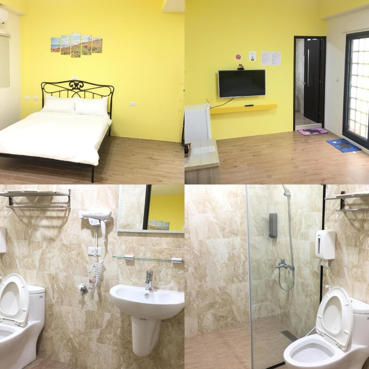 Una habitació amb llit, televisió i dutxa.