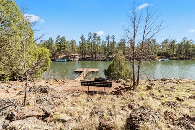 Rainbow Lake home in gated community with boats, hot tub, Tesla EV and lake acc
