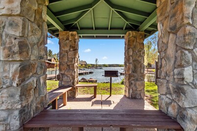 Rainbow Lake home in gated community w/ boats,  hot tub, and private lake access