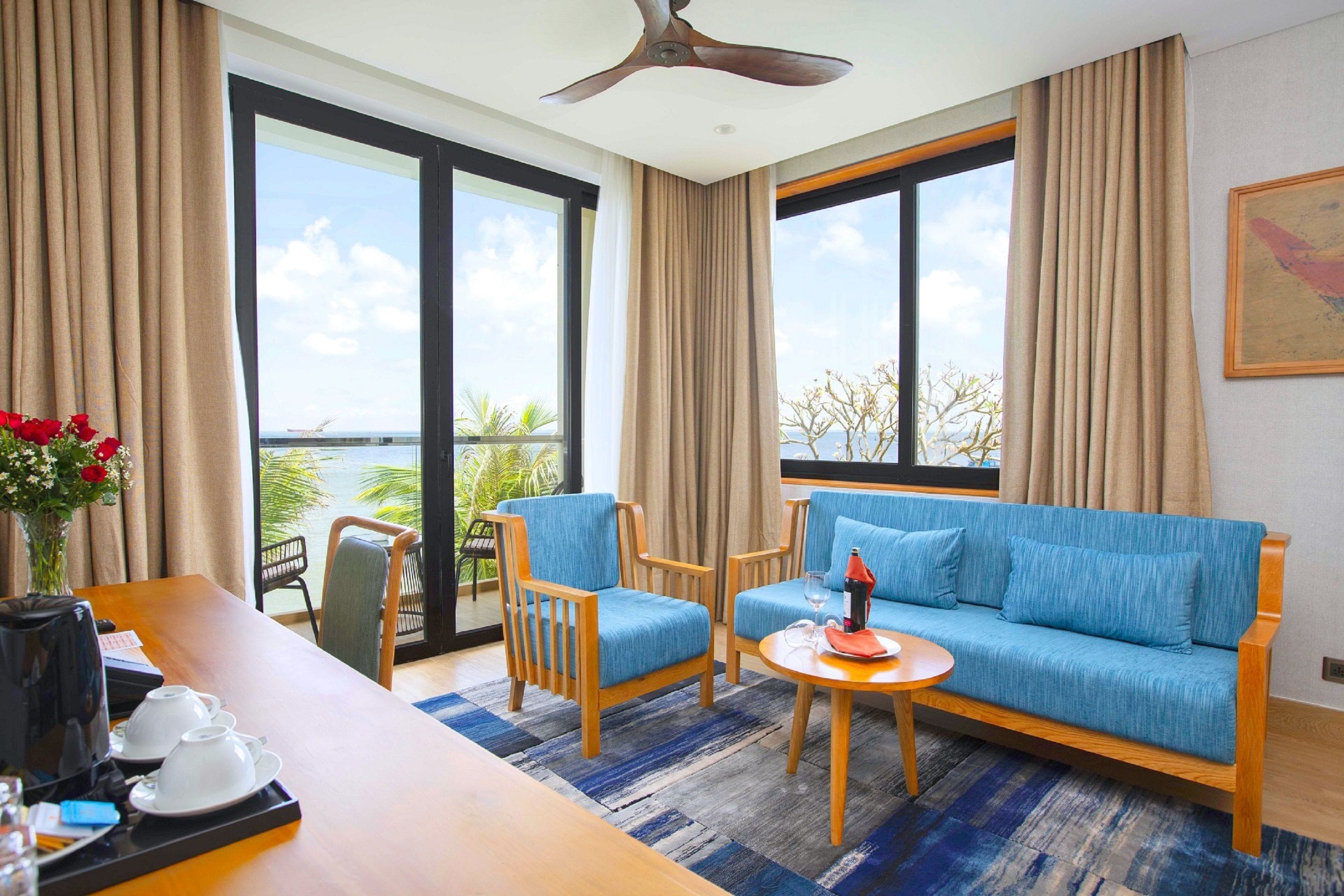 princess suite, ocean view | minibar, in-room safe, desk, laptop workspace