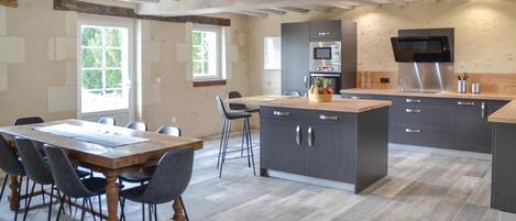 Fridge, stovetop, dishwasher, coffee/tea maker