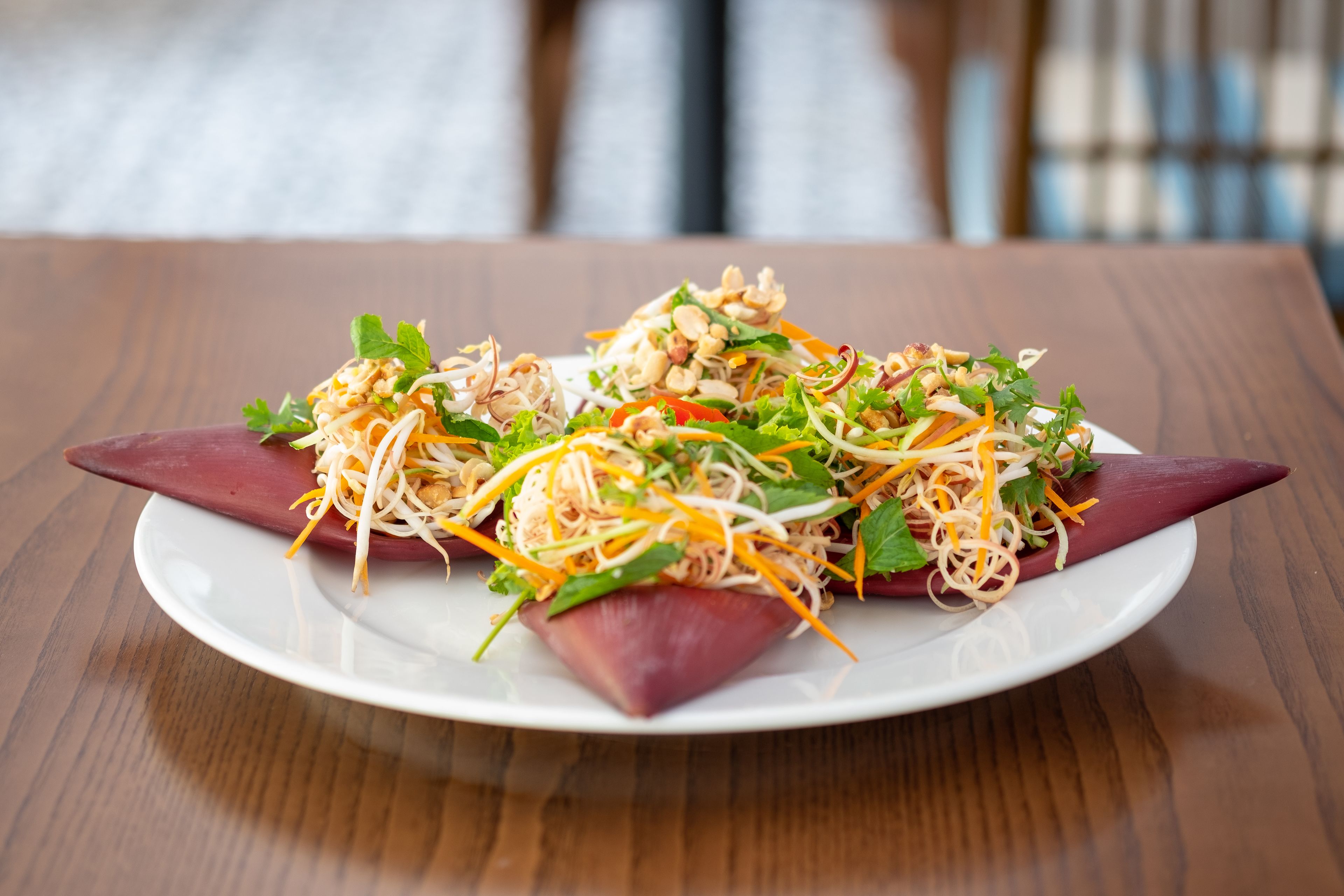 A plate of food on a wooden table.