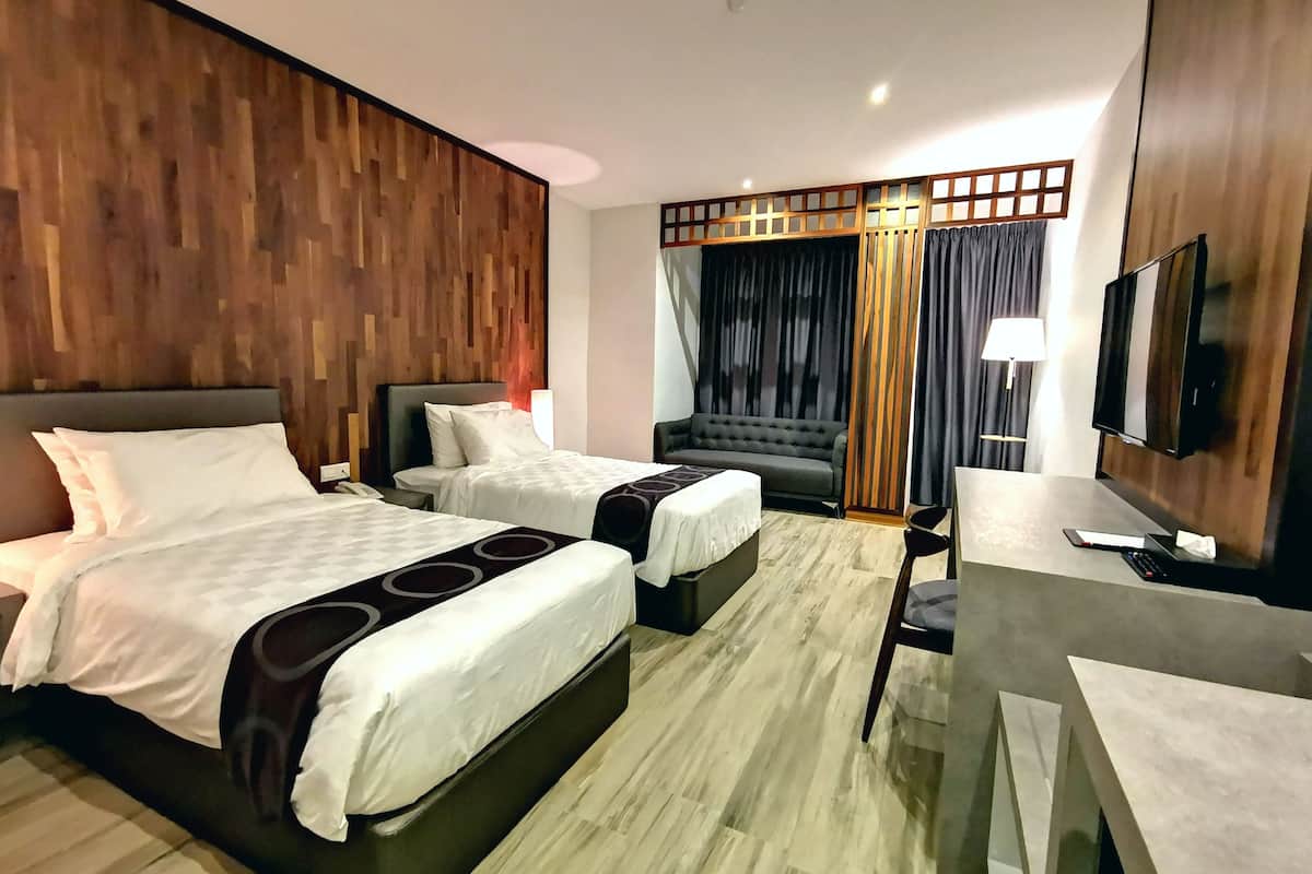 deluxe twin room, city view | in-room safe, desk, laptop workspace, iron/ironing board