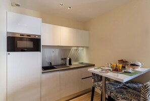 Fridge, microwave, stovetop, coffee/tea maker