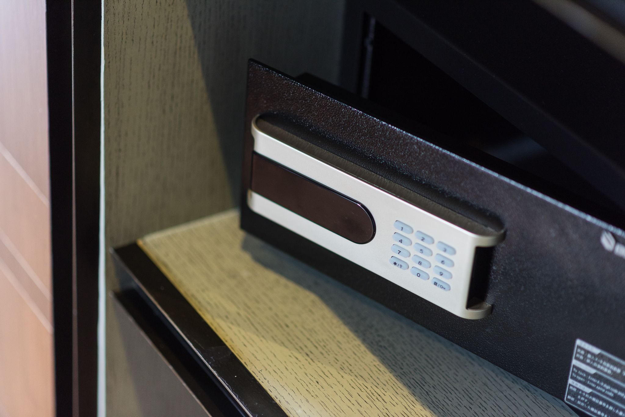 A keypad lock on a door, likely for a hotel room.