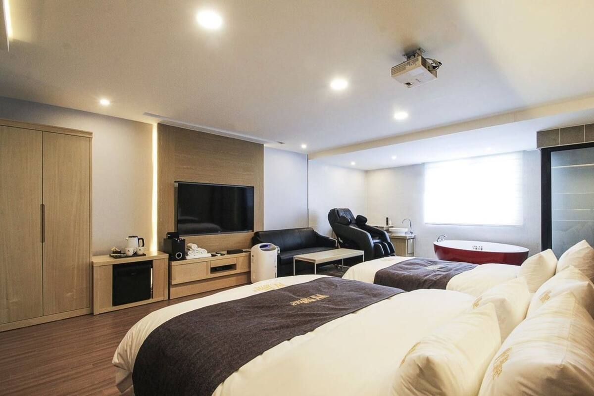 Premium bedding, down duvets, desk, laptop workspace