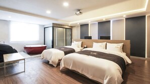 A modern hotel room with two beds, a red bathtub, a desk, and a large window. - New Yorker Hotel (Jinju)