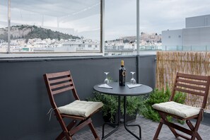Enjoy a romantic evening on the balcony with a view of the city, where you can sit and relax with a glass of wine.