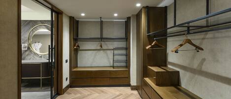 A modern bathroom with a vanity, a mirror, and a shower area.