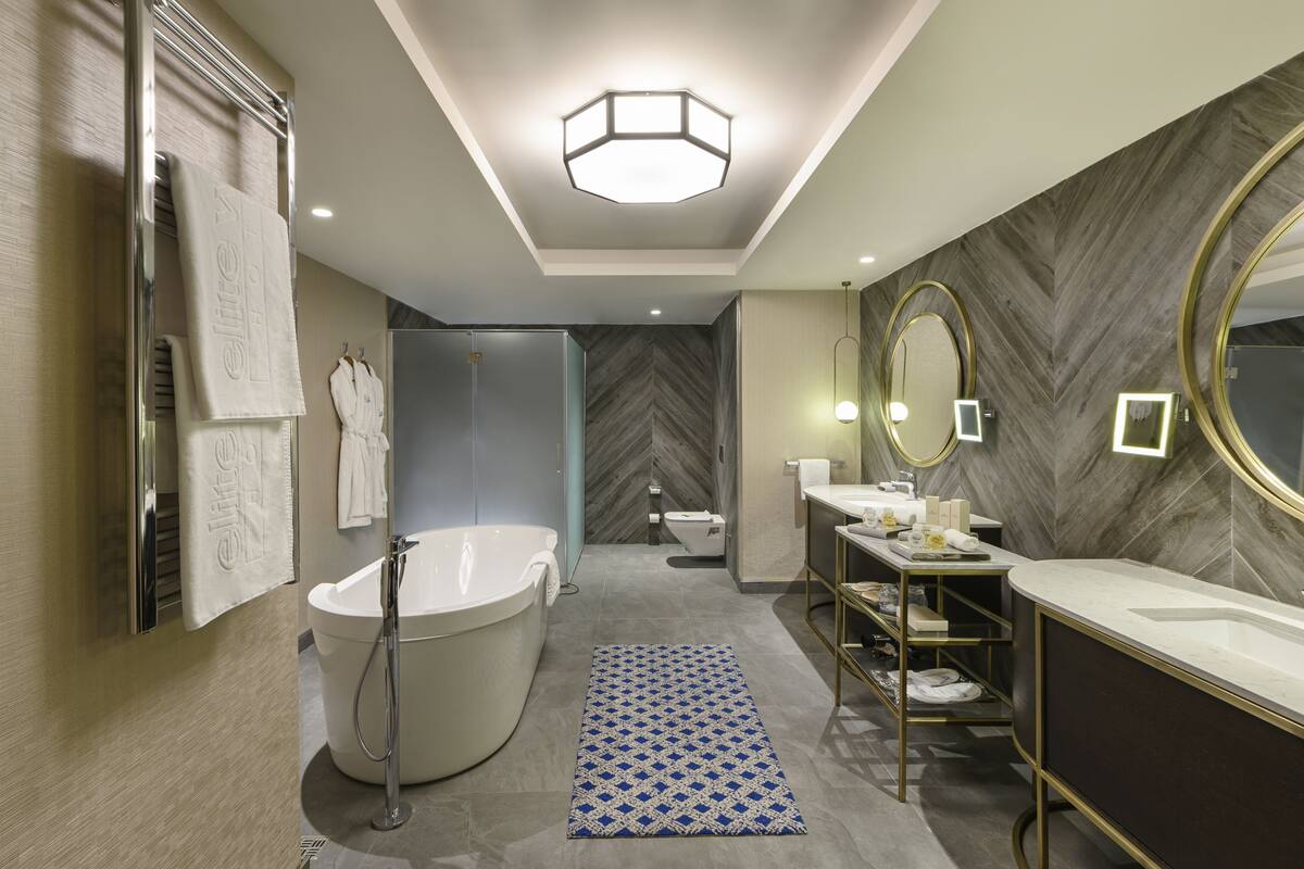 presidential suite with king size bed with forest view | bathroom | free toiletries, hair dryer, bathrobes, slippers