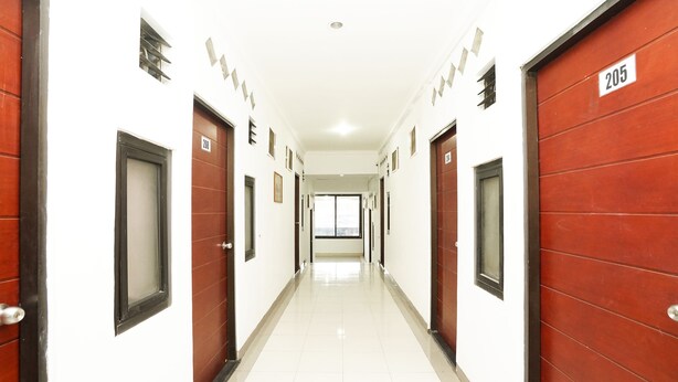 A corridor with doors numbered 200 and 205, leading to rooms.