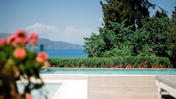 Indoor pool, outdoor pool, pool umbrellas, pool loungers