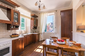 Apartment, 2 Bedrooms, Sea View | Private kitchen | Full-sized fridge, oven, stovetop, coffee/tea maker