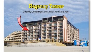A multi-story hotel with balconies, a beach in the foreground, and a pool on the roof. - Beachfront 1Br/1Ba condo, free parking & WiFi  w/ Heated Pool (North Wildwood)