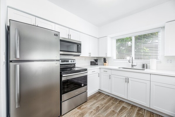 Fridge, microwave, stovetop, coffee/tea maker