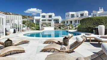 Outdoor pool, open 9:00 AM to 7:00 PM, free cabanas, pool umbrellas