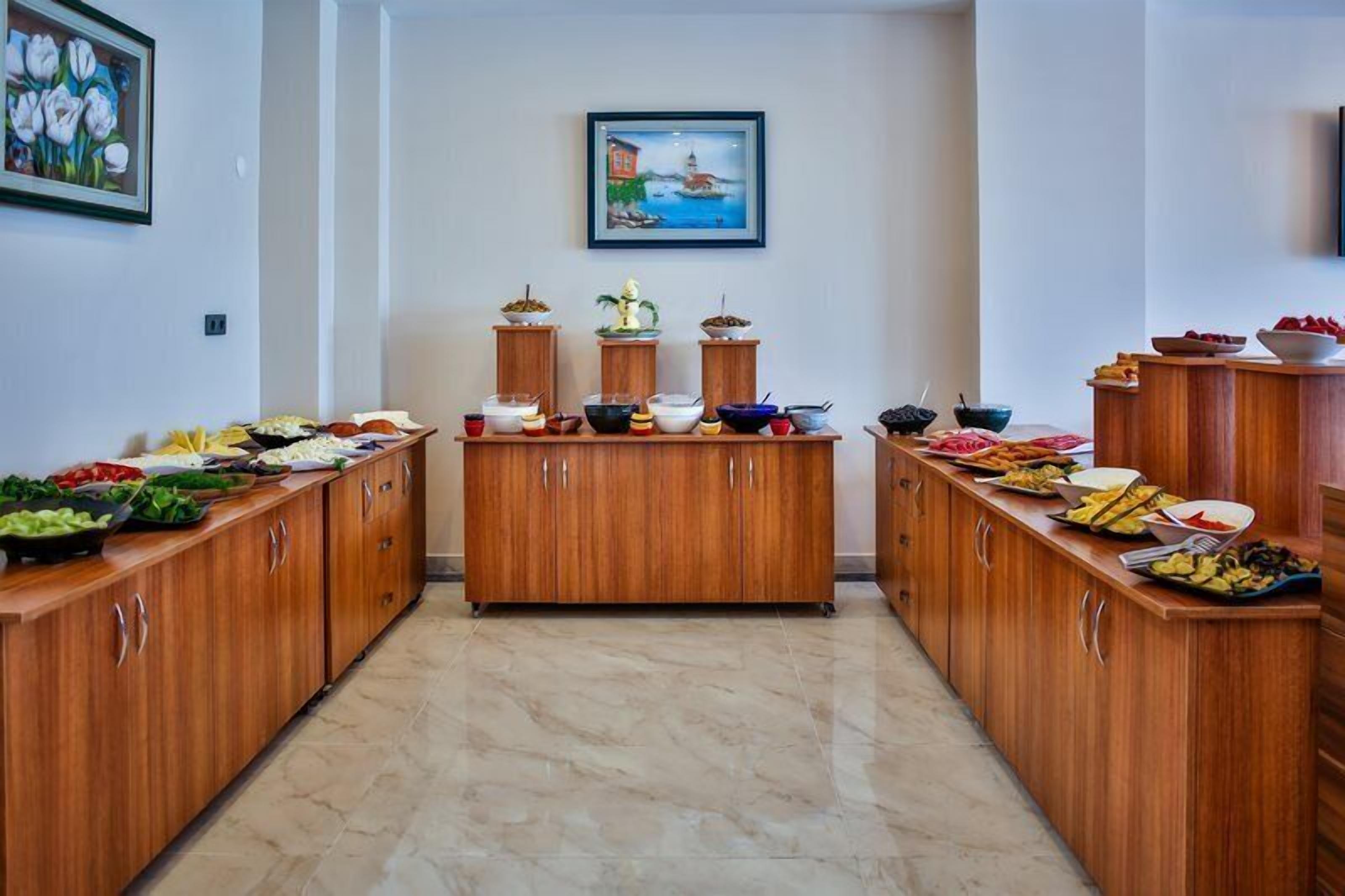 A buffet setup with multiple wooden cabinets and a central display.