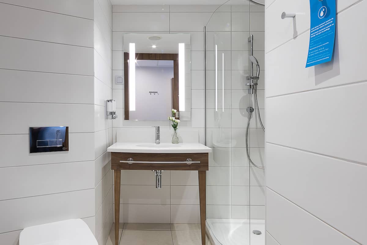 shower, rainfall showerhead, hair dryer, towels