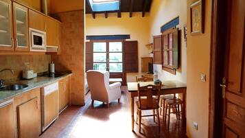 Apartment, 2 Bedrooms, Garden View | Private kitchen | Full-sized fridge, microwave, stovetop, coffee/tea maker