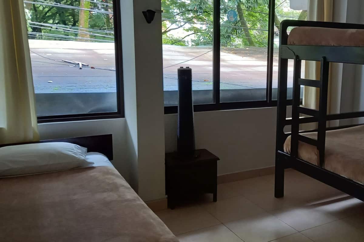 Triple Room, Non Smoking (Shared Bathroom) | Iron/ironing board, free WiFi, bed sheets