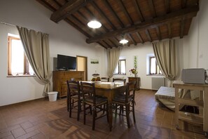 Family Apartment, 2 Bedrooms, Vineyard View (Mandorlo) | Living area | Flat-screen TV - Azienda Agricola I Colli di Marliano (Lastra a Signa)
