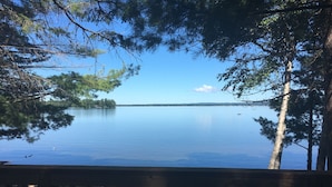 A lake view from a wooden deck with a clear sky. - Loon Lodge - Golden Lake (Cottage & Bunkie -Sleeps 8 ) (Killaloe)