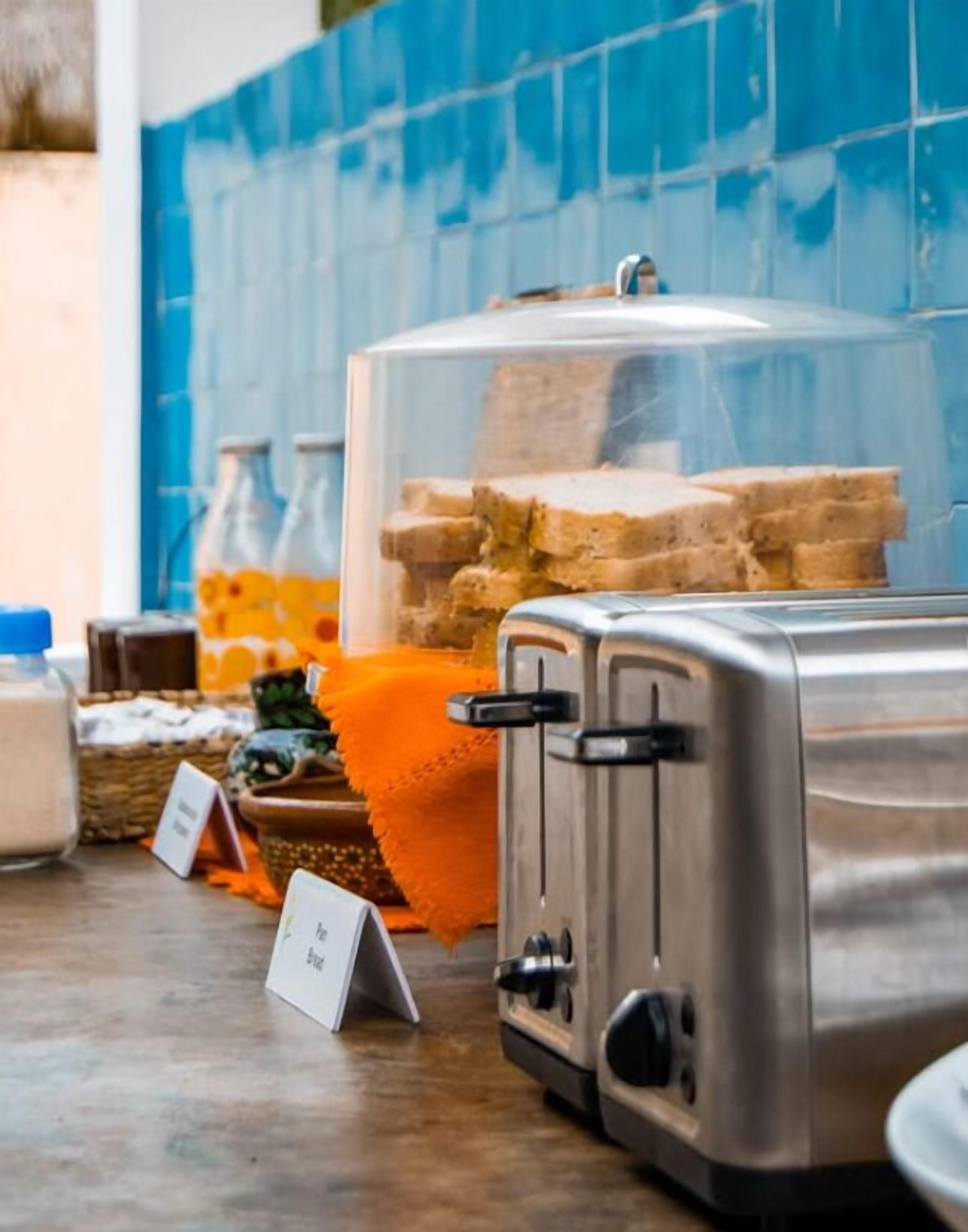 A breakfast buffet with various food items and a toaster.