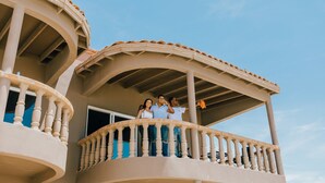 A multi-level balcony with a curved roof and a balustrade. - The Suites at Rocky Point 2 (Puerto Peñasco)