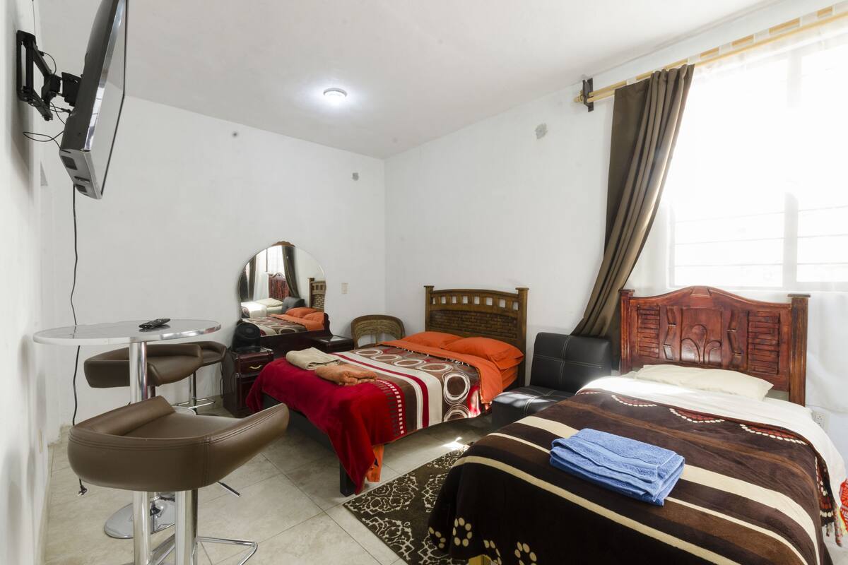 Classic Quadruple Room, 2 Double Beds, Courtyard View | In-room safe, iron/ironing board, WiFi (free), bed sheets
