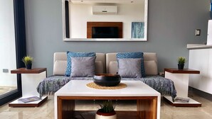 A modern living room with a sofa set, a coffee table, and two side tables. - MOB 205 by Riviera Rentals (Playa del Carmen)