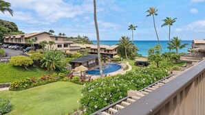 A resort with multiple buildings, a swimming pool, and a view of the ocean. - Gorgeous Ocean Views Family Vacation Condo - Kahana Sunset C1 (Lahaina)