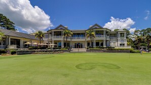 A large, two-story building with a well-maintained lawn in front. - 29 Stoney Creek - Harbour Town is just a quick walk away - Dog Friendly (Hilton Head Island)