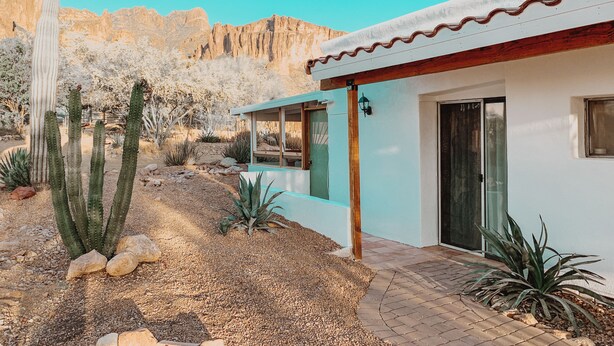A desert-style house with a patio, cacti, and a view of rocky mountains. - Casita at base of the Superstition Mountains. Unbelievable hiking and views. (Apache Junction)