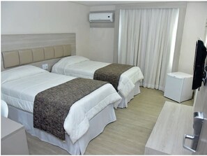 Standard Twin Room | Minibar, desk, laptop workspace, blackout drapes