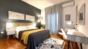A modern bedroom with a bed, bedside tables, a desk, and a chair. - Corfu-town Apartment best location/2BR/lift/removed/smart<br>TV+Netflix.<br>  (Kerkira)