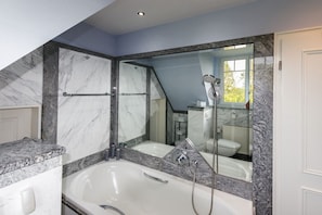 Bathtub, hair dryer, towels, soap