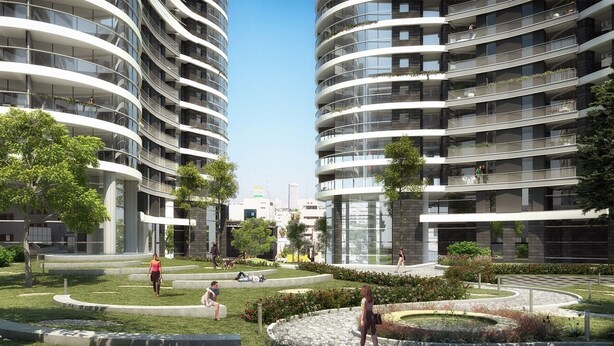 A modern residential building with curved balconies, a central courtyard, and surrounding greenery. - Beautiful 1 Bedroom in New GINDI Complex (Tel Aviv-Yafo)