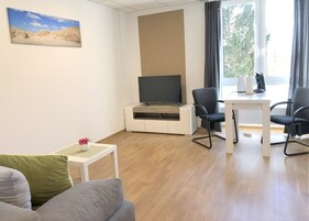 Basic Apartment (Seestern) | Living area | Flat-screen TV
