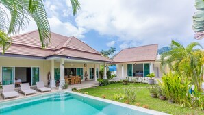A modern house with a swimming pool, covered patio, and lush garden. - PACOTTE, nice living villa with private (Rawai)